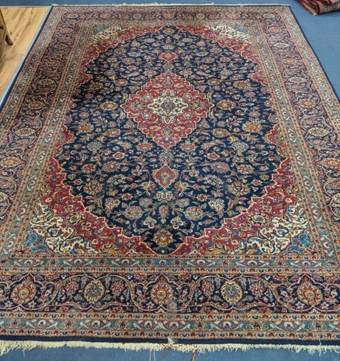 A Kashan style blue ground carpet 360 x 270cm